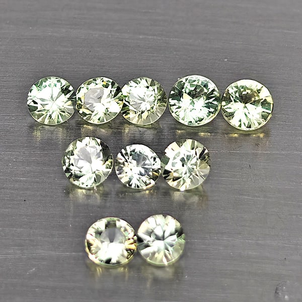 Natural Green Songea Sapphire Gemstones 0.81 Ct. 10 Pcs. Round Diamond Cut 2.7 Mm.: Product ID: 806130520 Product Name: Natural Blue Sapphire Weight: 0.81 CT. Size: 2.7 x 2.7 x 1.6 MM. Shape: Round Diamond Cut Color: Green Clarity:SI1 Luster: Good Gems Origin: Tanzania Treatment: Hea