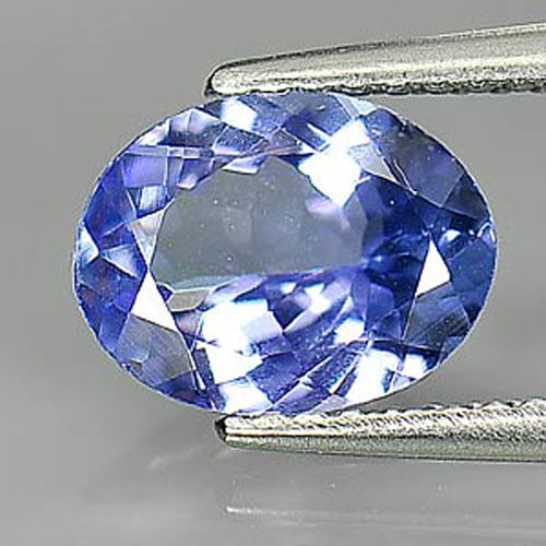 Natural Violetish Blue Tanzanite Gemstones 1.47 Ct. Oval Shape 8.8 x 6.8 Mm.: Product ID: 807009428 Product Name: Natural Tanzanite Weight: 1.47 CT. Size: 8.8 x 6.8 x 3.6 MM. Shape: Oval Color: Violetish Blue Clarity:VVS Luster: Good Gems Origin: Tanzania Treatment: Heated Crys