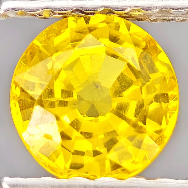 Natural Yellow Sapphire Gemstones 0.63 Ct. Round Shape 5.1 Mm.: Product ID: 806162931 Product Name: Natural Yellow Sapphire Weight: 0.63 CT. Size: 5.1 x 5.1 x 3.1 MM. Shape: Round Shape Color: Yellow Clarity:VSI Luster: Good Gems Origin: Thailand Treatment: Heated