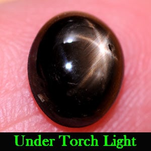 Natural Black Star Sapphire Gemstones 2.02 Ct. Oval Cabochon Shape 8.2 x 6.8 Mm.: Product ID: 806137634 Product Name: Natural Star Sapphire Weight: 2.02 CT. Size: 8.2 x 6.8 x 3.4 MM. Shape: Oval Cabochon Color: Black Clarity:Opaque Luster: Good 6 Rays Star Gems Origin: Thailand Tre