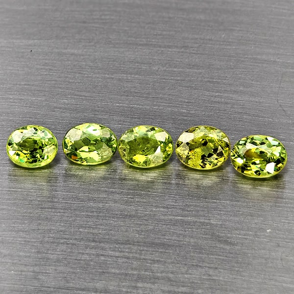 Natural Green Demantiod Garnet Gemstones 1.17 Ct. 5 Pcs.Oval Shape 4.2 x 3.3 Mm.: Product ID: 802937554 Product Name: Natural Demantoid Weight: 1.17 CT. Size: 4.2 x 3.3 x 2 MM. Shape: Oval Color: Green Clarity:SI1 Luster: Good Gems Origin: Madagascar Treatment: Unheated Crystal Str
