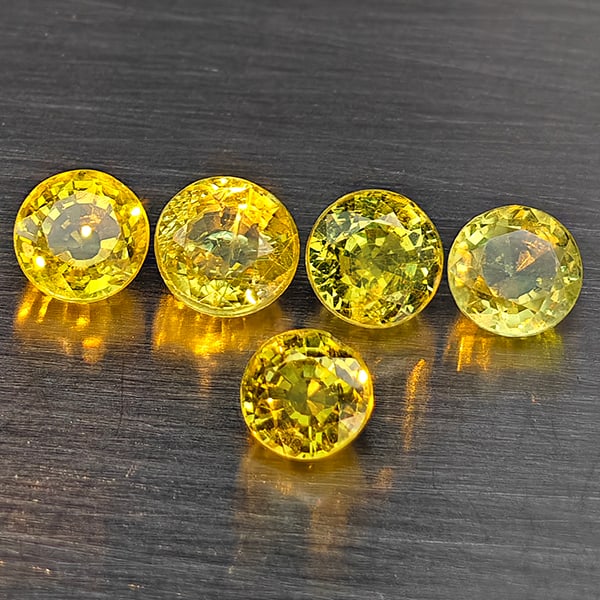 Natural Greenish Yellow Titanium Rainbow Spark Sphene Gemstones 1.72 Ct. 5 Pcs. Round Shape 4 Mm.: Product ID: 806509379 Product Name: Natural Sphene Weight: 1.72 CT. Size: 4 x 4 x 2.5 MM. Shape: Round Color: Greenish Yellow Clarity:SI1 Luster: Good Gems Origin: Madagascar Treatment: Unheated Cryst