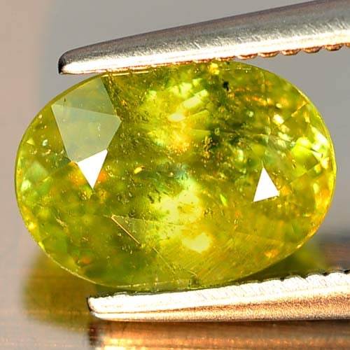 Natural Green Sphene Red Spark Gemstones 2.08 Ct. Oval Shape 9 x 6.4 Mm.: Product ID: 806501744 Product Name: Natural Sphene Weight: 2.08 CT. Size: 9 x 6.4 x 4.8 MM. Shape: Oval Color: Intense Green Clarity:SI Luster: Adamantine Gems Origin: Madagascar Treatment: Unheated C