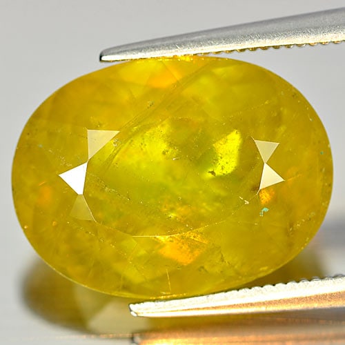 Natural Multi Color Sphene Gemstones 11.57 Ct. Oval Shape 16.2 X 12.2 Mm.