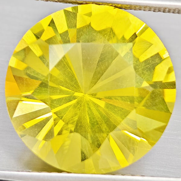 Natural Yellow Lemon Quartz Gemstones 10.51 Ct. Round Diamond Cut 15.1 Mm.: Product ID: 805530120 Product Name: Natural Quartz Weight: 10.51 CT. Size: 15.1 x 15.1 x 9.8 MM. Shape: Round Diamond Cut Color: Yellow Lemon Clarity:VSI Luster: Good Gems Origin: Brazil Treatment: Un