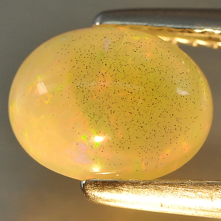 Natural Multi Color Opal Gemstones 1.23 Ct. Oval Cabochon Shape 8.4 x 6.6 Mm.: Product ID: 818715622 Product Name: Natural Opal Weight: 1.23 CT. Size: 8.4 x 6.6 x 4.7 MM. Shape: Oval Cabochon Color: Multi Color Clarity:Opaque Luster: Good Gems Origin: Ethiopia Treatment: Unheate