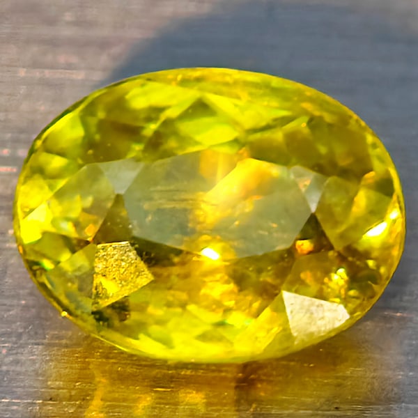 Natural Multi Color Titanium Rainbow Spark Sphene Gemstones 1.65 Ct. Oval Shape 8.1 x 6.2 Mm.