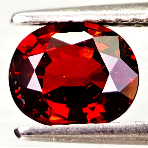 Natural Orangish Red Spessartine Garnet Gemstones 1.43 Ct.Oval Shape 7.1 x 5.9 Mm.: Product ID: 802936605 Product Name: Natural Spessartine Weight: 1.43 CT. Size: 7.1 x 5.9 x 3.6 MM. Shape: Oval Color: Orangish Red Clarity:VSI Luster: Good Gems Origin: Namibia Treatment: Unheated Cry