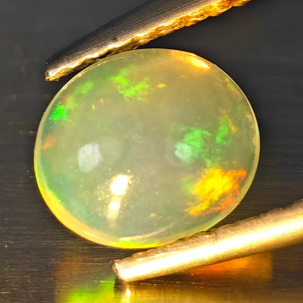 Natural Multi Color Opal Gemstones 0.94 Ct. Oval Cabochon Shape 8.3 x 6.3 Mm.