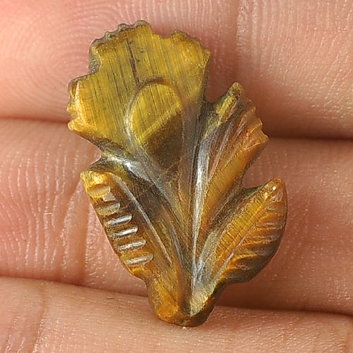 Natural Golden Tiger Eye Gemstones 7.43 Ct. Carving Leaves Shape 20.2 x 12.2 Mm.: Product ID: 811600006 Product Name: Natural Tiger eye Weight: 7.43 CT. Size: 20.2 x 12.2 x 4.2 MM. Shape: Carving Leaves Color: Golden Clarity:Opaque Luster: Good Gems Origin: Thailand Treatment: Unhe