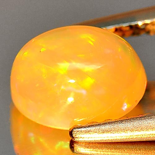 Natural Multi Color Play Of Colour Opal Gemstones 0.71 Ct. Oval Cabochon Shape 7.2 x 5.4 Mm.: Product ID: 818726257 Product Name: Natural Opal Weight: 0.71 CT. Size: 7.2 x 5.4 x 4.1 MM. Shape: Oval Cabochon Color: Multi Color Clarity:Semi - Transparent Luster: Iridescent Gems Origin: Ethiopia 