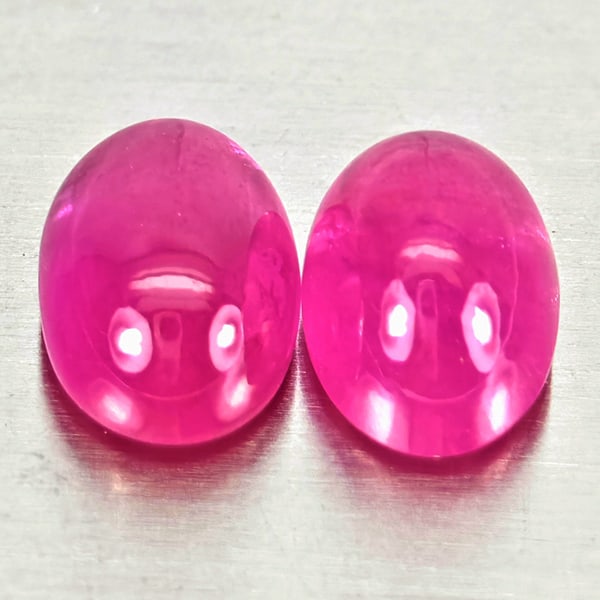 Natural Pink Red Jonson Ruby 1.75 Ct. 2 Pcs. Oval Cabochon Shape 6.2 x 4.2 Mm.: Product ID: 805935745 Product Name: Natural Ruby Weight: 1.75 CT. Size: 6.2 x 4.2 x 3 MM. Shape: Oval Cabochon Color: Pink Red Clarity:Semi - Transparent Luster: Good Gems Origin: Mozambique Treatment