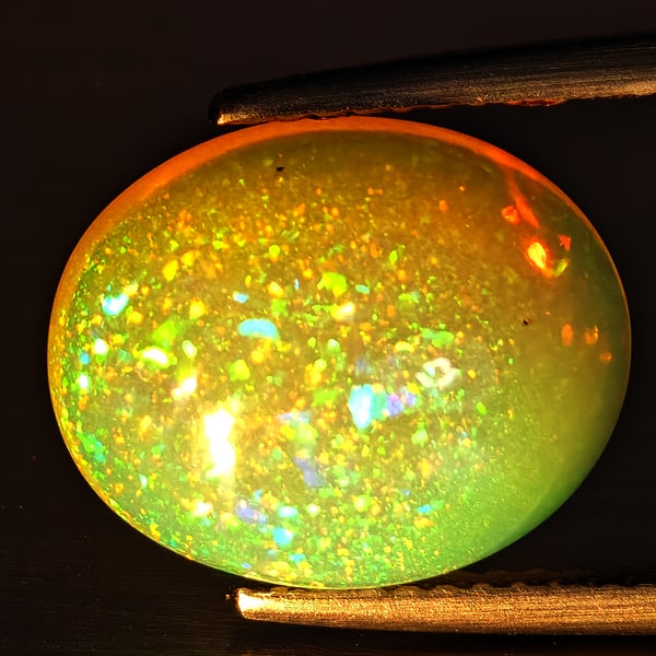 Natural Multi-Color Play Of Colour Opal Gemstone 4.43 Ct. Oval Cabochon Shape 13.4 x 10.8 Mm.
