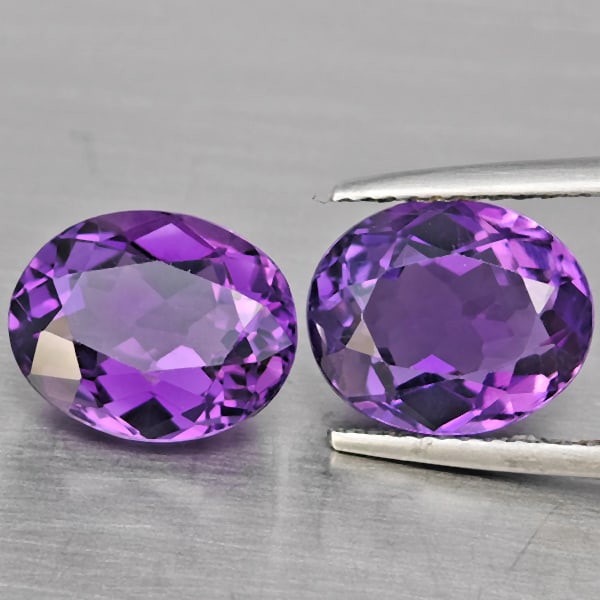 Natural Purple Amethyst Gemstones 6.86 Ct. 2 Pcs. Oval Shape 10.9 x 9 Mm.: Product ID: 800325613 Product Name: Natural Amethyst Weight: 6.86 CT. Size: 10.9 x 9 x 6 MM. Shape: Oval Color: Purple Clarity:VSI Luster: Good Gems Origin: Brazil Treatment: Unheated Crystal Structur