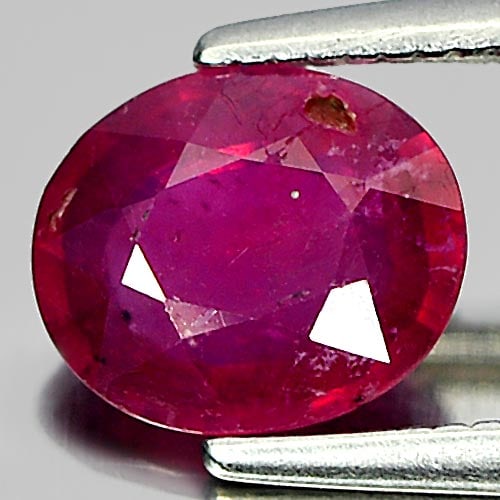Natural Purplish Red Ruby Gemstones 1.23 Ct. Oval Shape 7.2 x 6.2 Mm.: Product ID: 805916507 Product Name: Natural Ruby Weight: 1.23 CT. Size: 7.2 x 6.2 x 2.9 MM. Shape: Oval Color: Purplish Red Clarity:VSI Luster: Good Gems Origin: Madagascar Treatment: Heated (Lead-gla