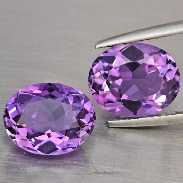 Natural Purple Amethyst Gemstones 5.62 Ct. 2 Pcs. Oval Shape 10.5 x 8.7 Mm.: Product ID: 800325598 Product Name: Natural Amethyst Weight: 5.62 CT. Size: 10.5 x 8.7 x 5.9 MM. Shape: Oval Color: Purple Clarity:VSI Luster: Good Gems Origin: Brazil Treatment: Unheated Crystal Stru