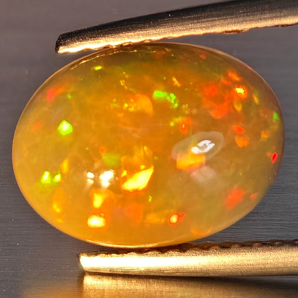 Natural Multi-Color Play Of Colour Opal Gemstone 1.99 Ct. Oval Cabochon Shape 11.4 x 8.4 Mm.