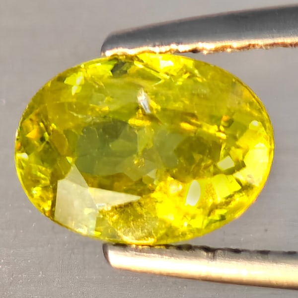 Natural Intense Green Sphene Gemstones With Rainbow Spark 1.63 Ct. Oval Shape 8.5 x 6.1 Mm.