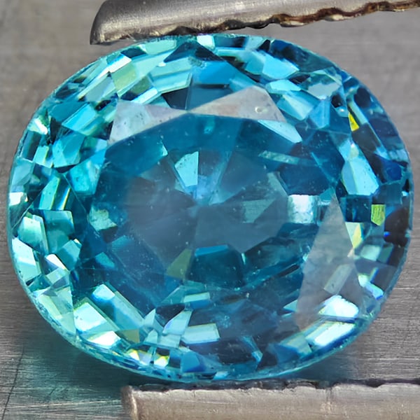 Natural Blue Zircon Gemstones 2.32 Ct. Oval Shape 7.3 x 6.2 Mm.: Product ID: 807743077 Product Name: Natural Zircon Weight: 2.32 CT. Size: 7.3 x 6.2 x 4.8 MM. Shape: Oval Shape Color: Blue Clarity:VSI Luster: Good Gems Origin: Cambodia Treatment: Heated Crystal Str