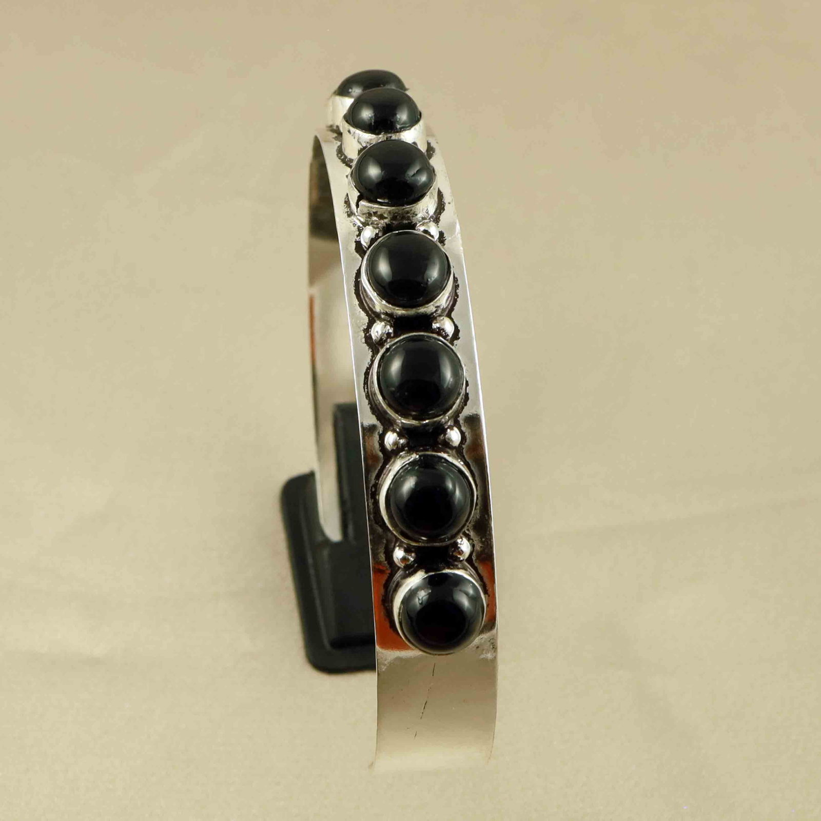 Natural Black Onyx Sterling Silver Plated Handmade Cuff Bangle: Product ID: 260607182418 Product - Handmade Silver Plated Cuff Bangle Metal - 92.5 Sterling Silver Plated Bangle Size - 6.5x5.5 CM (Adjustable) Gemstone - Black Onyx Gemstone Origin - India Gemstone S