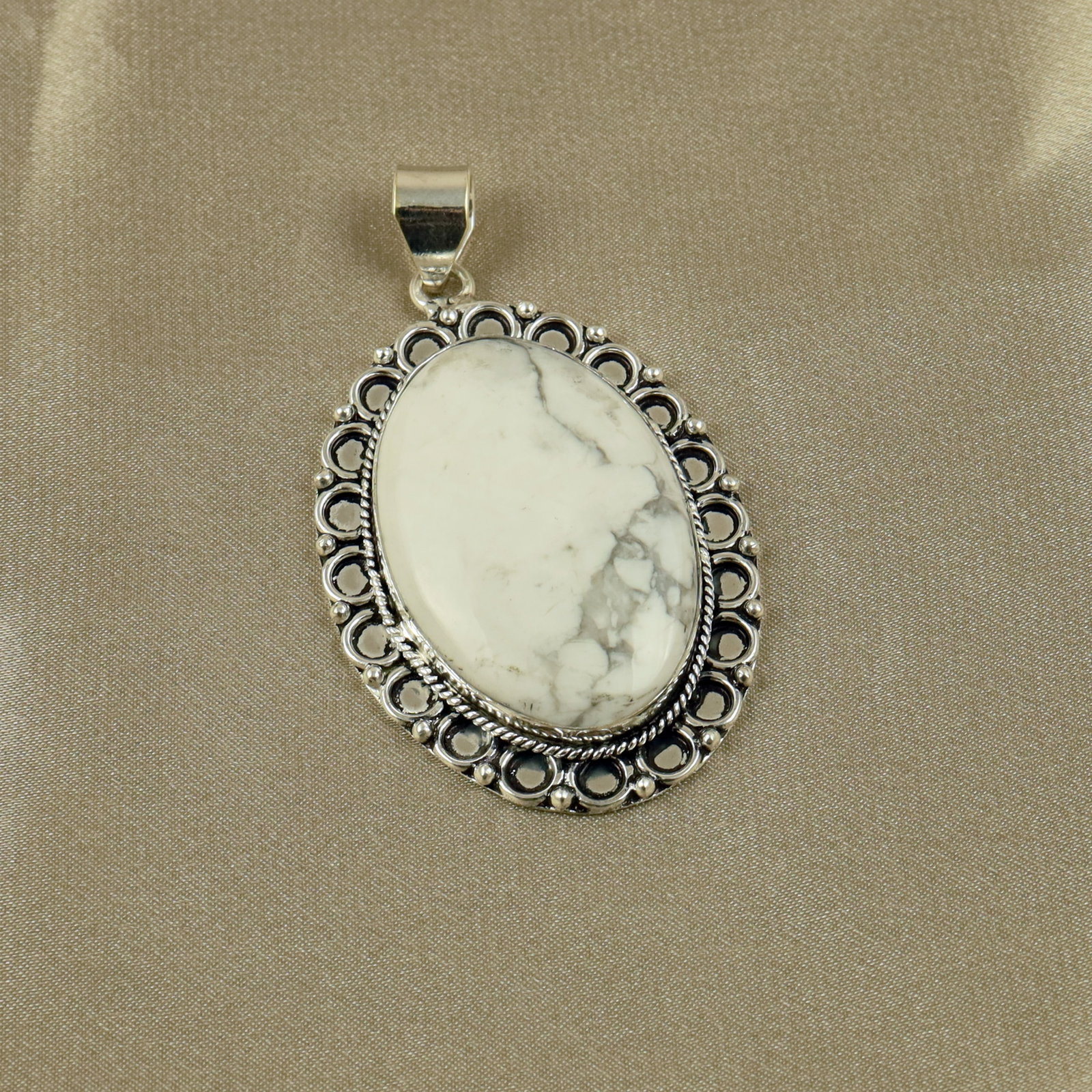 Natural Howlite Sterling Silver Plated Handmade Pendant: Product ID: 260518140742 Product - Handmade Silver Plated Pendant Metal - 92.5 Sterling Silver Plated Pendant Size - 4.5x3.5CM Gemstone - Howlite Gemstone Origin - Canada Gemstone Shape - Oval Pendant
