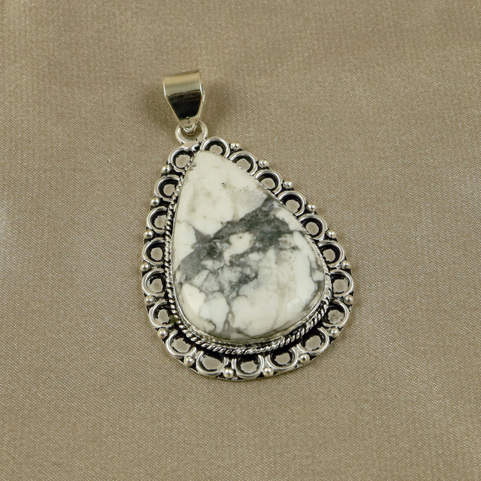 Natural Howlite Sterling Silver Plated Handmade Pendant: Product ID: 260518140106 Product - Handmade Silver Plated Pendant Metal - 92.5 Sterling Silver Plated Pendant Size - 4.5x3CM Gemstone - Howlite Gemstone Origin - Canada Gemstone Shape - Pear Pendant W