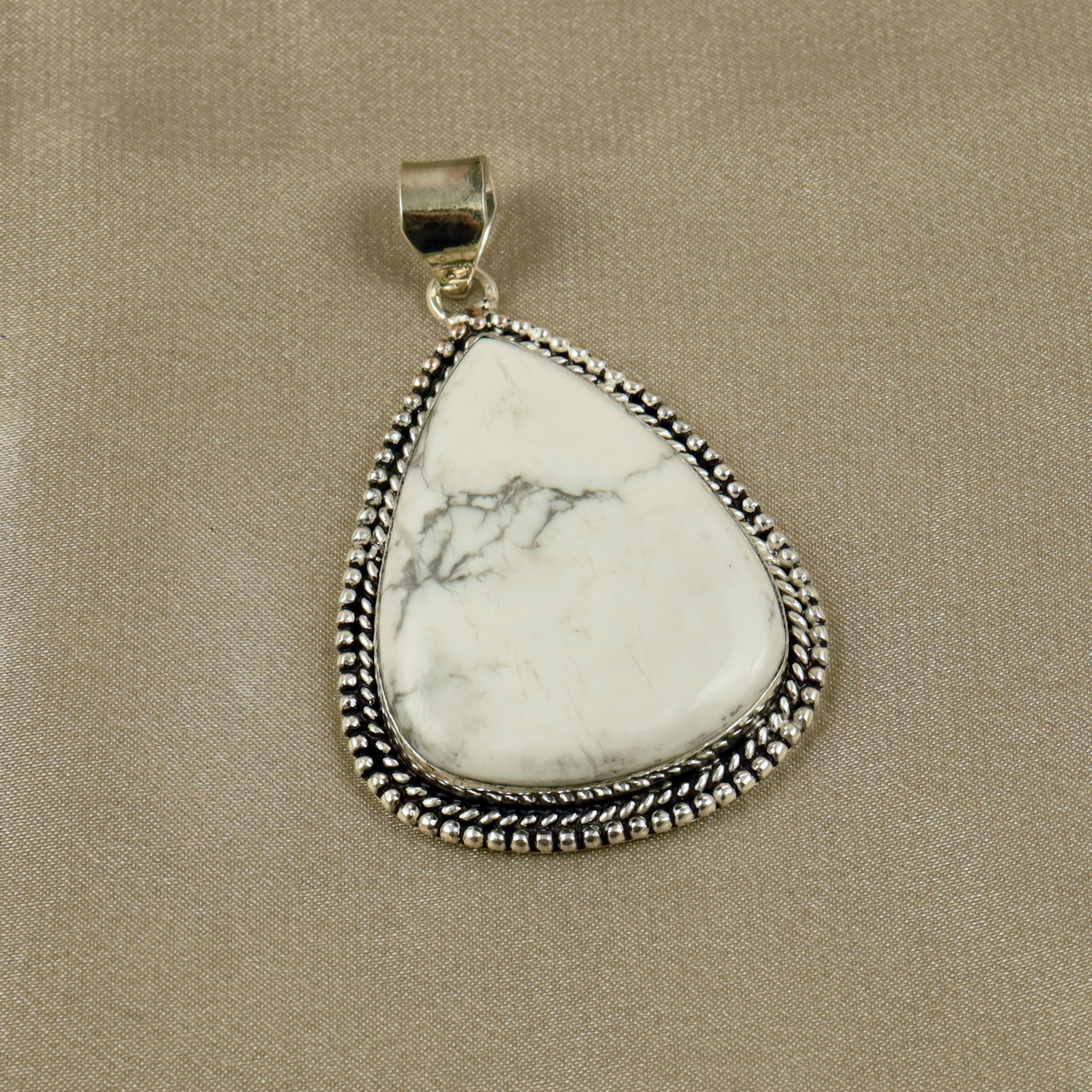 Natural Howlite Sterling Silver Plated Handmade Pendant: Product ID: 260518135908 Product - Handmade Silver Plated Pendant Metal - 92.5 Sterling Silver Plated Pendant Size - 4.5x3.5CM Gemstone - Howlite Gemstone Origin - Canada Gemstone Shape - Pear Pendant