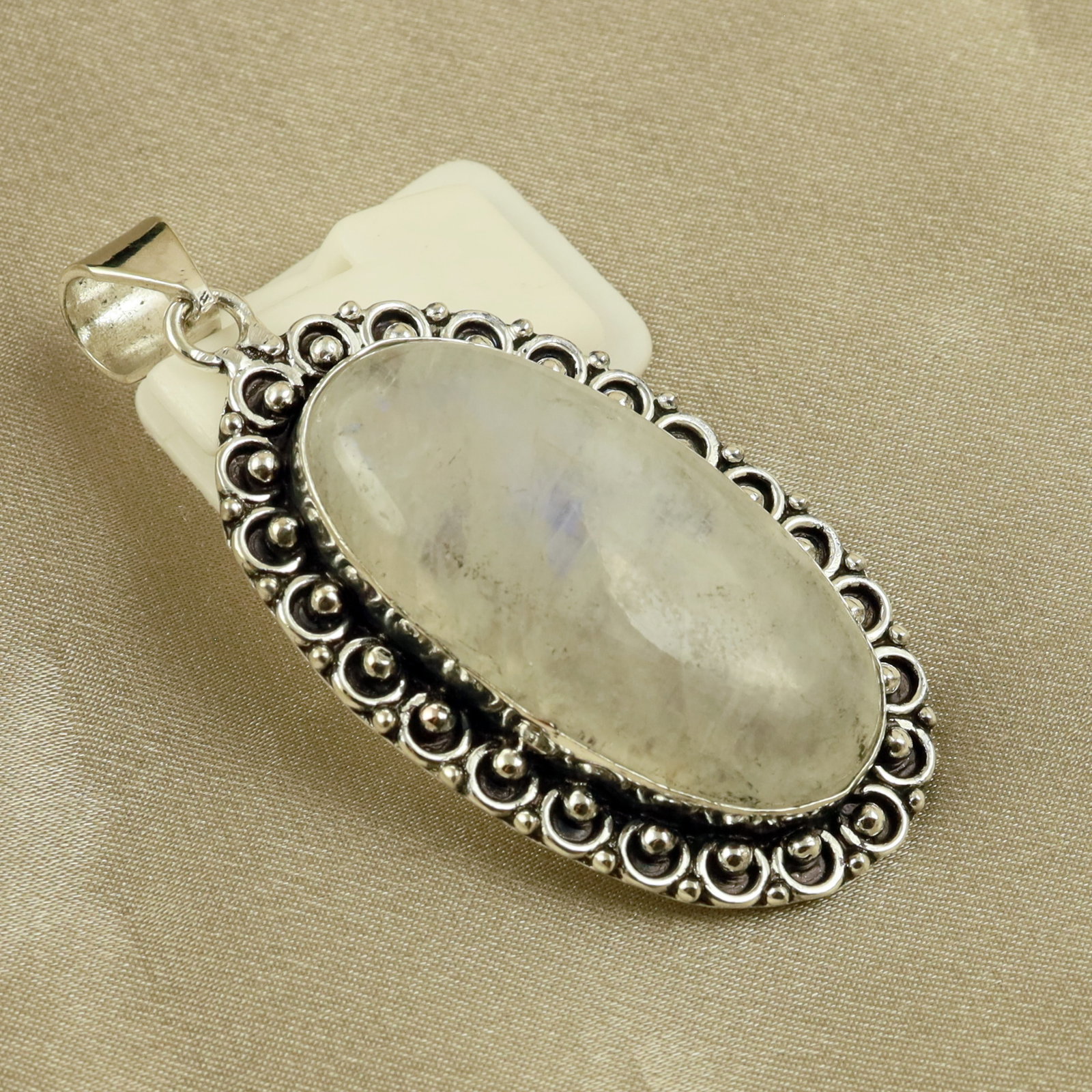 Natural Rainbow Moonstone Sterling Silver Plated Handmade Pendant: Product ID: 260518130212 Product - Handmade Silver Plated Pendant Metal - 92.5 Sterling Silver Plated Pendant Size - 4.5x3CM Gemstone - Rainbow Moonstone Gemstone Origin - India Gemstone Shape - Oval 