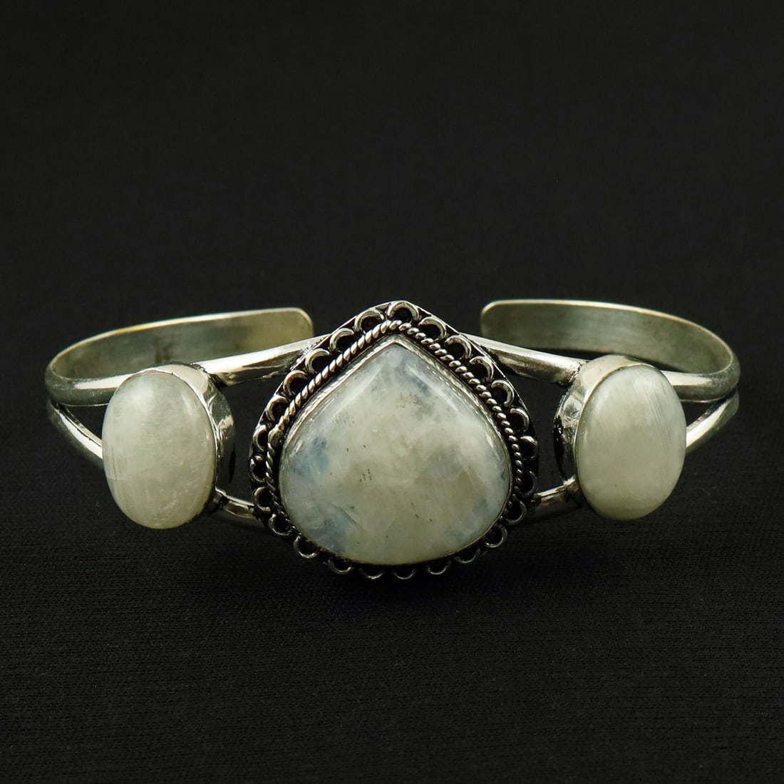Natural Rainbow Moonstone Silver Plated Handmade Cuff Bangle: Product ID: 260524154135 Product - Handmade Silver Plated Cuff Bangle Metal - 92.5 Sterling Silver Plated Bangle Size - 7.5x5.5 CM (Adjustable) Gemstone - Rainbow Moonstone Gemstone Origin - India Gem