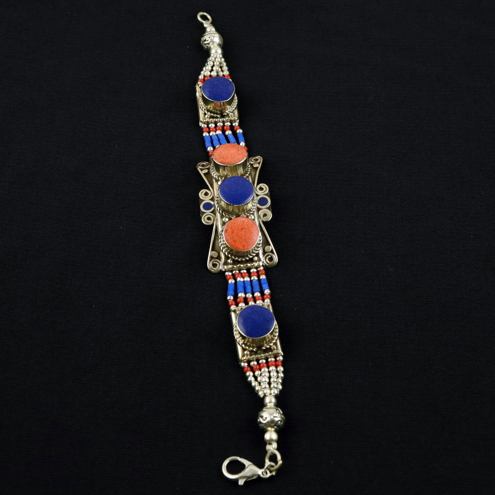 Afghani Natural Lapis Lazuli & Red Coral Handmade Boho Bracelet: Product ID: 260520120311 Product - Tibetan Handmade Ethnic Bracelet Gemstone - Natural Lapis Lazuli & Coral Size - 7 Inch Weight - 50 Gram Approx Metal - Brass & Copper mix Metal Origin - Nepal Countr