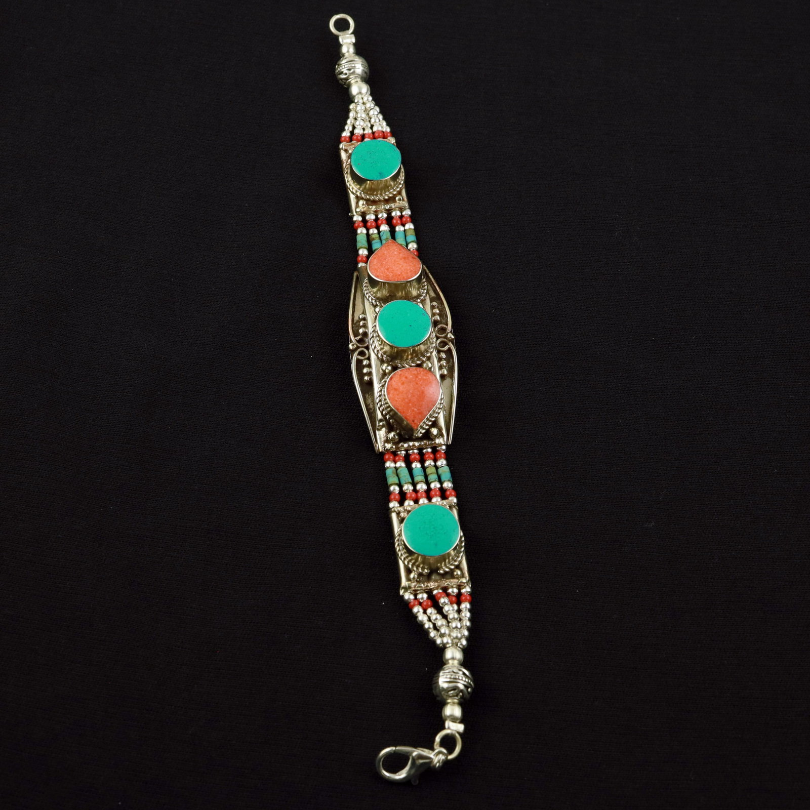 Tibetan Turquoise & Coral Handmade Designer Bracelet: Product ID: 260520114721 Product - Tibetan Handmade Ethnic Bracelet Gemstone - Natural Turquoise & Coral Size - 7 Inch Weight - 50 Gram Approx Metal - Brass & Copper mix Metal Origin - Nepal Country/R