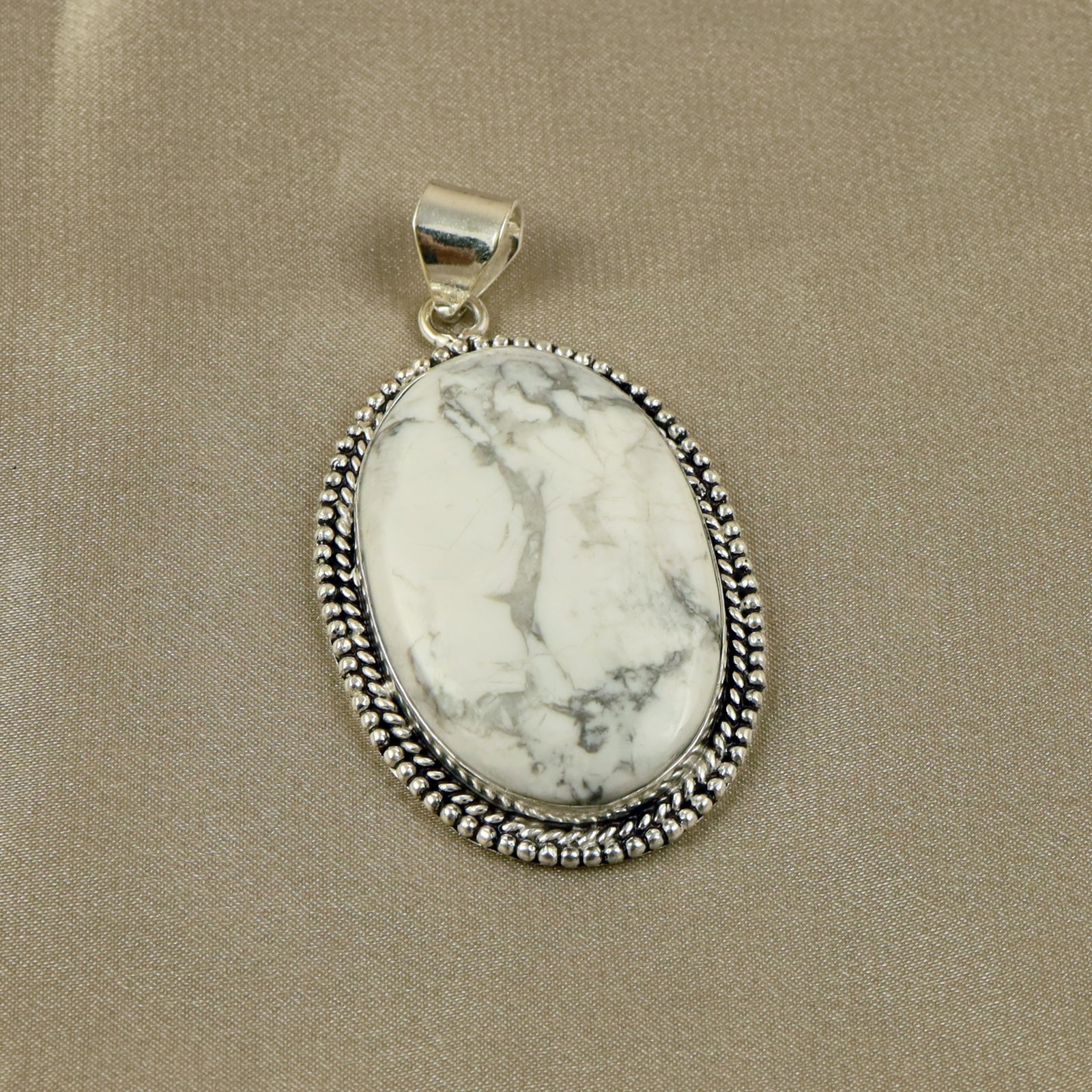 Natural Howlite Sterling Silver Plated Handmade Pendant: Product ID: 260518140516 Product - Handmade Silver Plated Pendant Metal - 92.5 Sterling Silver Plated Pendant Size - 4.5x3CM Gemstone - Howlite Gemstone Origin - Canada Gemstone Shape - Oval Pendant W