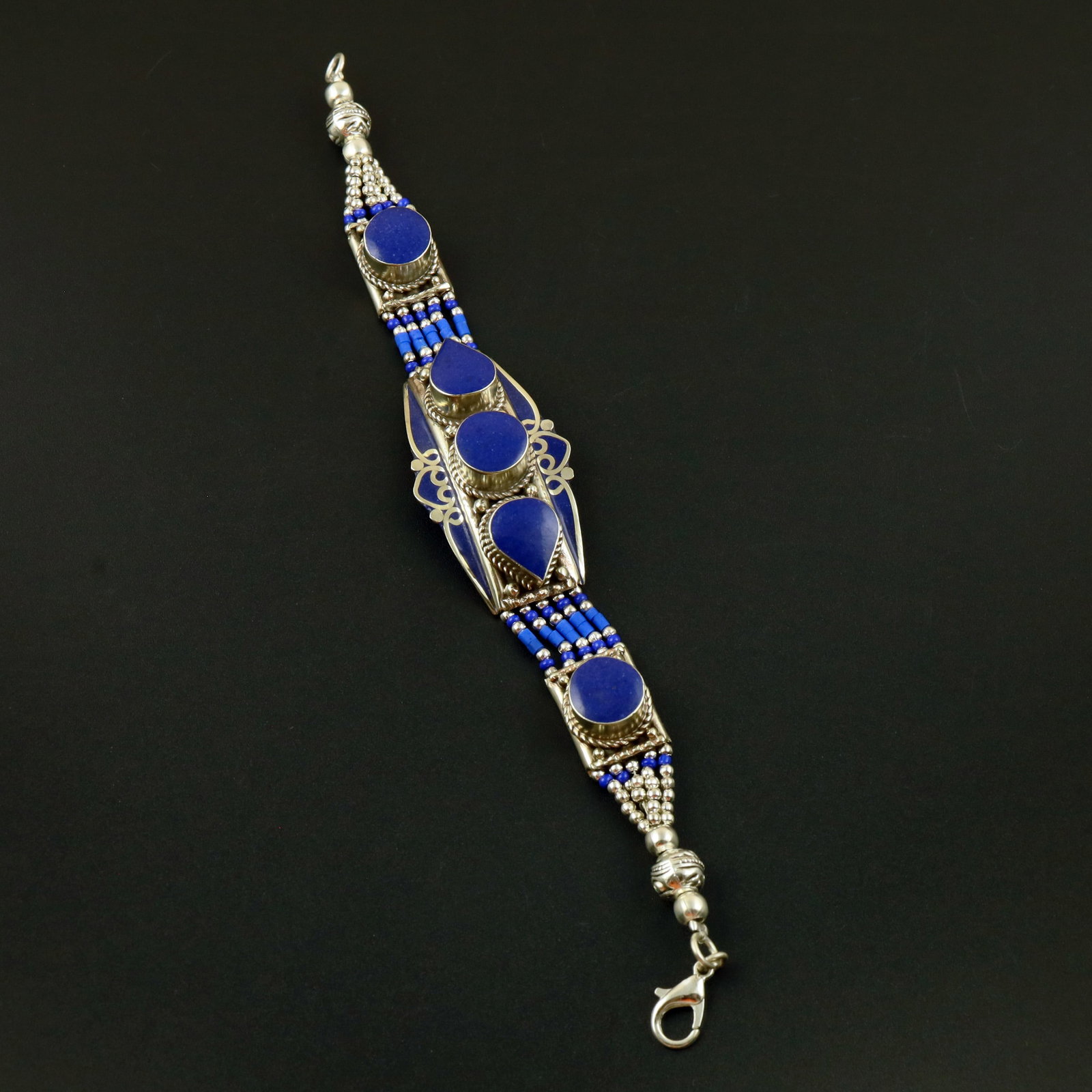Afghani Natural Lapis Lazuli Handmade Hippie Bracelet: Product ID: 260513130128 Product - Tibetan Handmade Ethnic Bracelet Gemstone - Natural Lapis Lazuli Size - 7 Inch Weight - 50 Gram Approx Metal - Brass & Copper mix Metal Origin - Nepal Country/Region