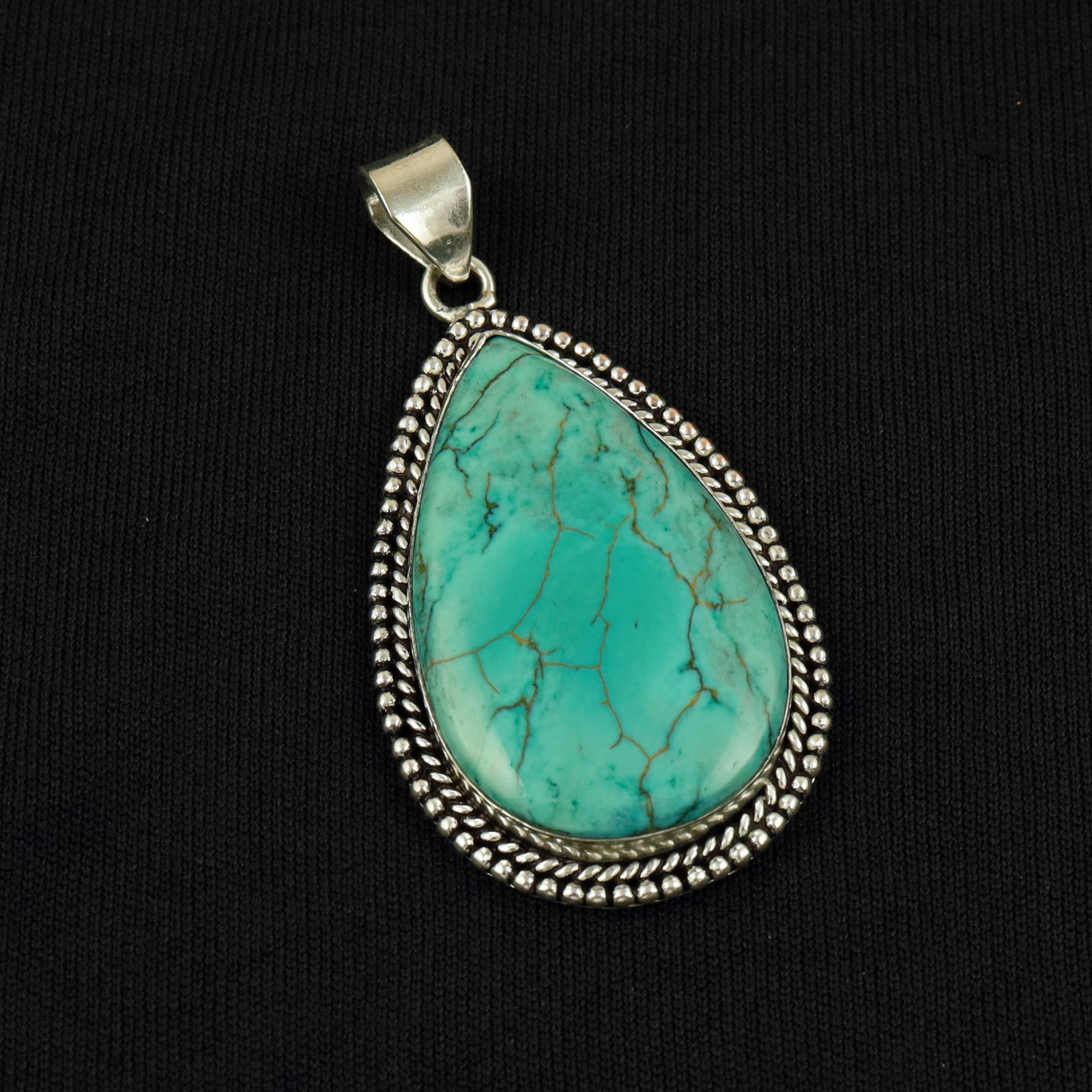 Natural Turquoise Sterling Silver Plated Handmade Pendant: Product ID: 260513102636 Product - Handmade Silver Plated Pendant Metal - 92.5 Sterling Silver Plated Pendant Size - 4.5x3 CM Gemstone - Turquoise Gemstone Origin - Tibet Gemstone Shape - Pear Pendant