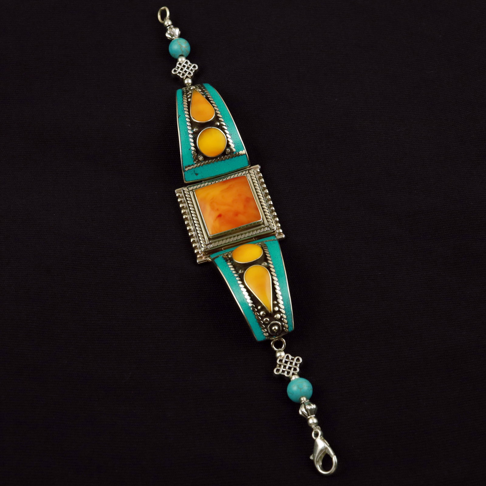 Tibetan Turquoise & Copal Handmade Ethnic Bold Bracelet: Product ID: 260512185438 Product - Tibetan Handmade Ethnic Bracelet Gemstone - Natural Turquoise & Copal Size - 7 Inch Weight - 40 Gram Approx Metal - Brass & Copper mix Metal Origin - Nepal Country/R