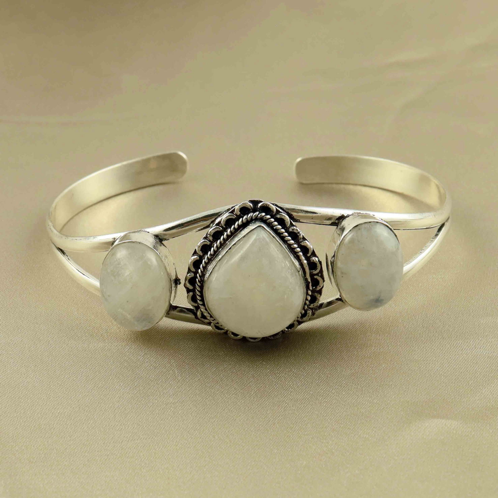 Natural Rainbow Moonstone Sterling Silver Plated Handmade Cuff Bangle: Product ID: 260524154709 Product - Handmade Silver Plated Cuff Bangle Metal - 92.5 Sterling Silver Plated Bangle Size - 7.5x5.5 CM (Adjustable) Gemstone - Rainbow Moonstone Gemstone Origin - India Gem