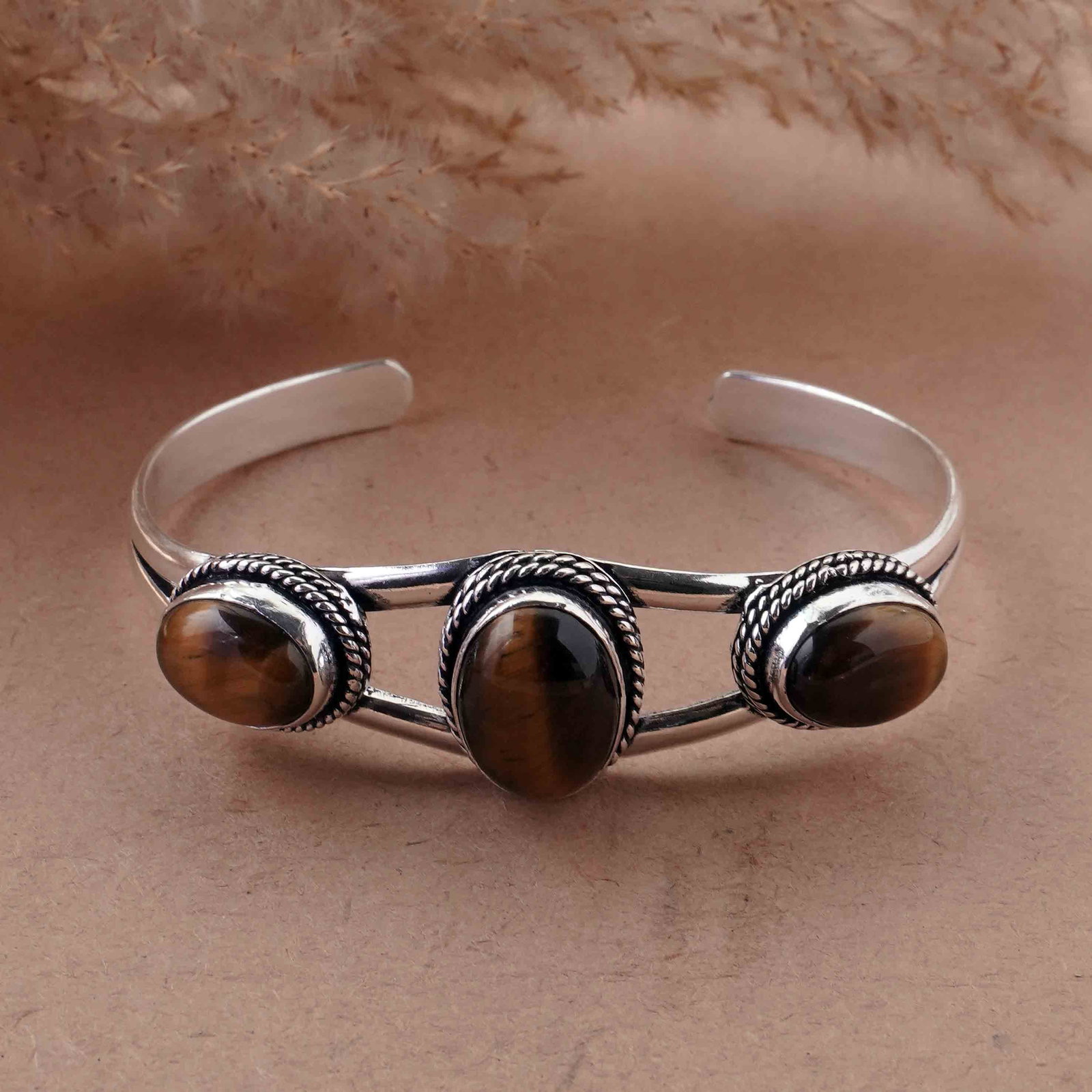Natural Tiger Eye Sterling Silver Plated Handmade Cuff Bangle: Product ID: 260429152444 Product - Handmade Silver Plated Cuff Bangle Metal - 92.5 Sterling Silver Plated Bangle Size - 6.5x4.5 CM (Adjustable) Gemstone - Tiger Eye Gemstone Origin - South Africa Gems