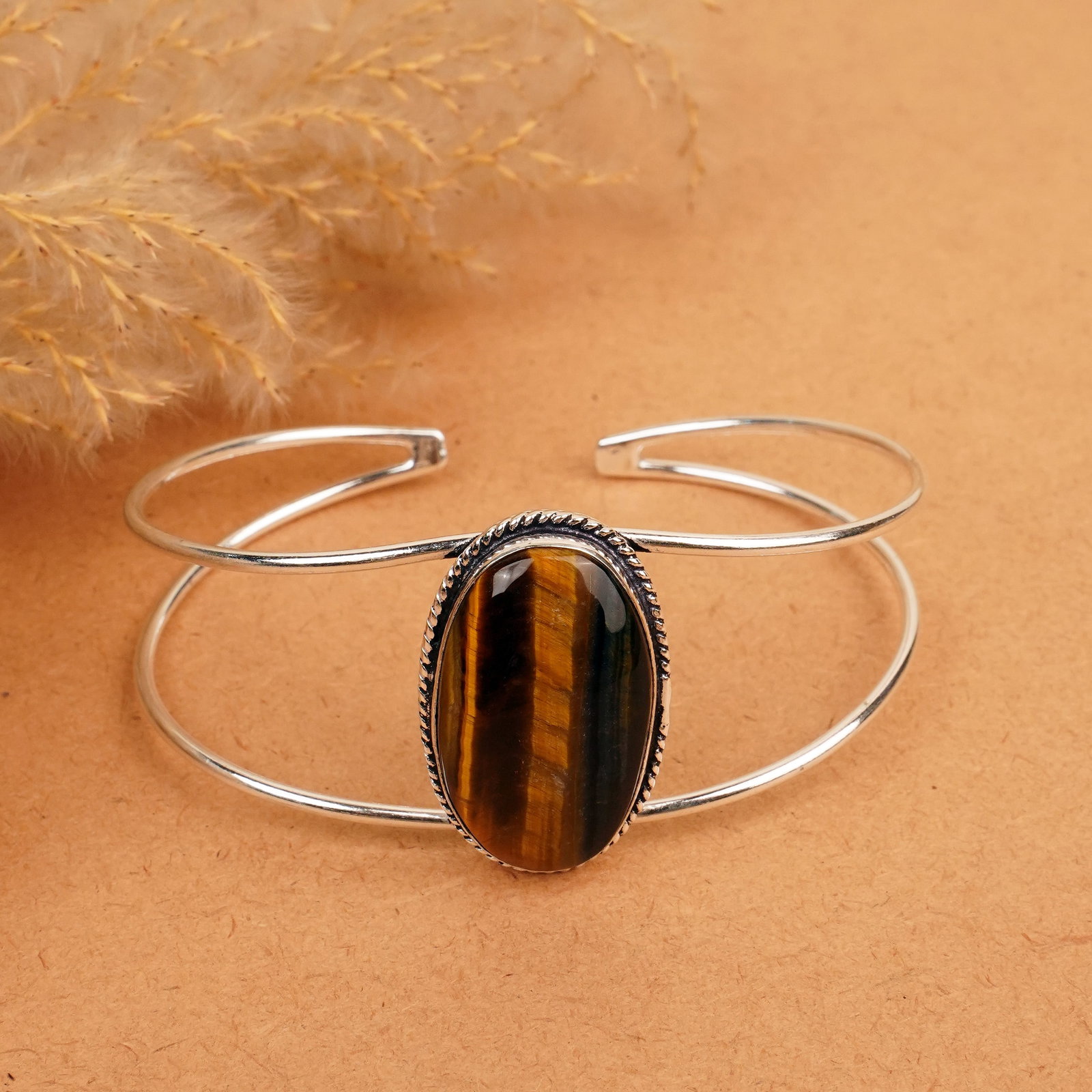 Natural Tiger Eye Sterling Silver Plated Handmade Cuff Bangle: Product ID: 260412130718 Product - Handmade Silver Plated Cuff Bangle Metal - 92.5 Sterling Silver Plated Bangle Size - 7.5x5.5 CM (Adjustable) Gemstone -Tiger Eye Gemstone Origin - South Africa Gemst