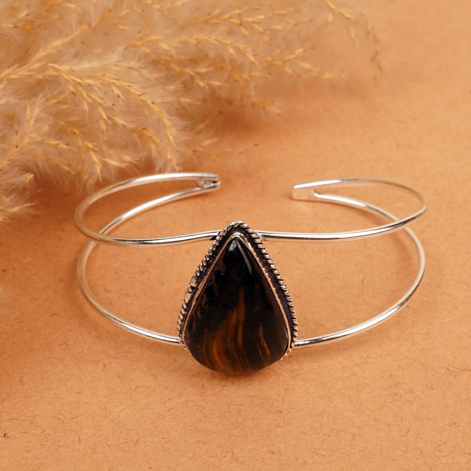 Natural Black Tiger Eye Silver Plated Handmade Cuff Bangle: Product ID: 260412125625 Product - Handmade Silver Plated Cuff Bangle Metal - 92.5 Sterling Silver Plated Bangle Size - 7.5x5.5 CM (Adjustable) Gemstone - Black Tiger Eye Gemstone Origin - South Afric