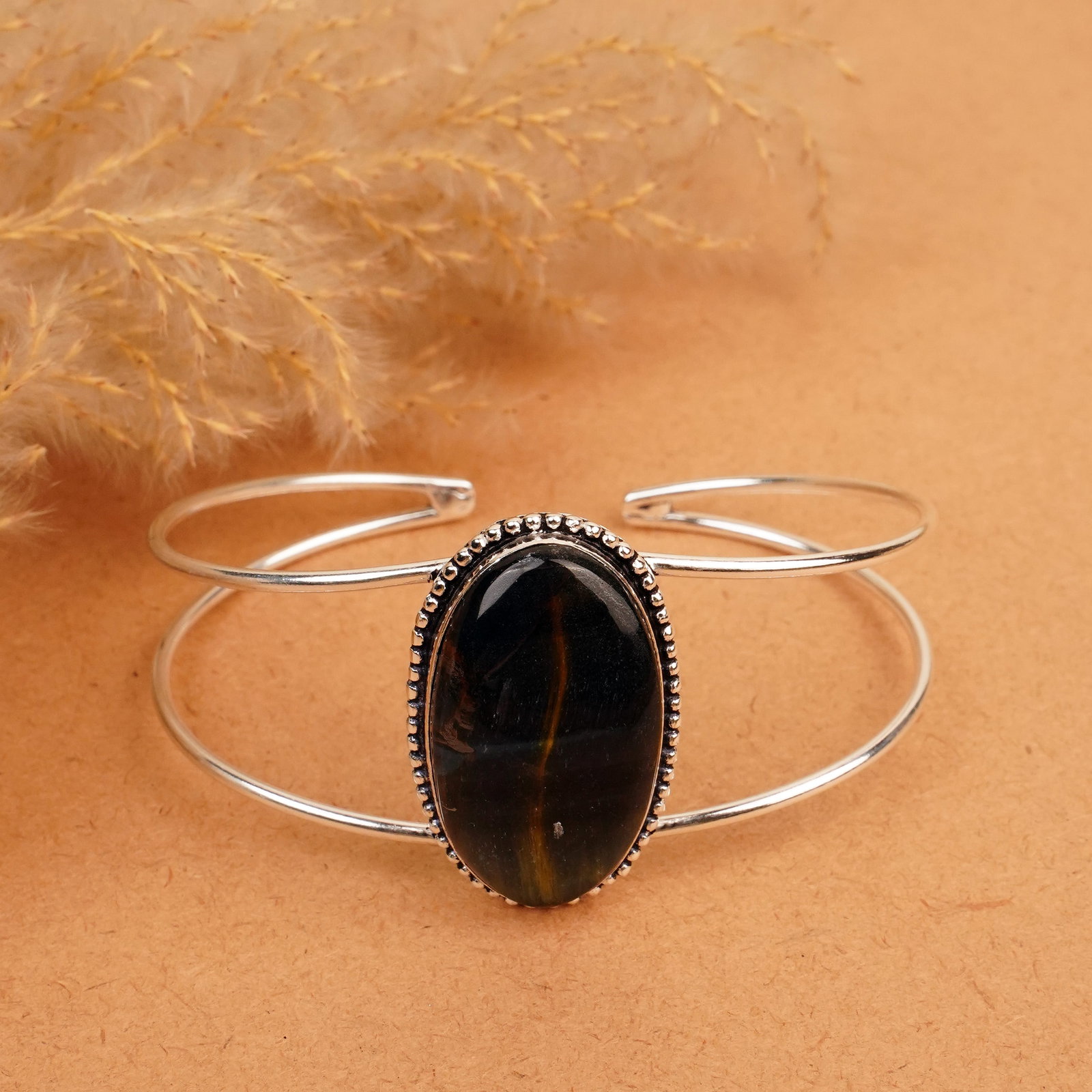 Natural Black Tiger Eye Silver Plated Handmade Cuff Bangle: Product ID: 260412125211 Product - Handmade Silver Plated Cuff Bangle Metal - 92.5 Sterling Silver Plated Bangle Size - 7.5x5.5 CM (Adjustable) Gemstone - Black Tiger Eye Gemstone Origin - South Afric