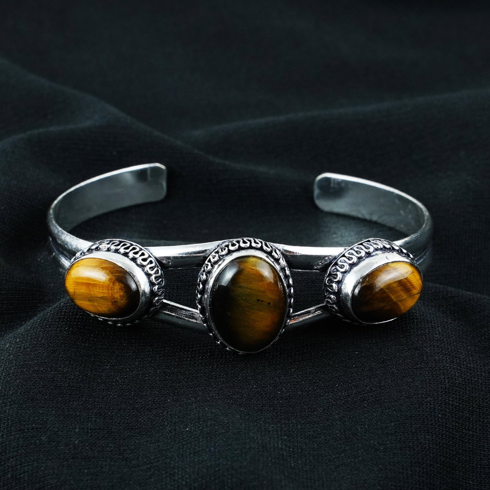 Natural Tiger Eye Sterling Silver Plated Handmade Cuff Bangle: Product ID: 260404124219 Product - Handmade Silver Plated Cuff Bangle Metal - 92.5 Sterling Silver Plated Bangle Size - 6.5x5.5 CM (Adjustable) Gemstone - Tiger Eye Gemstone Origin - South Africa Gems