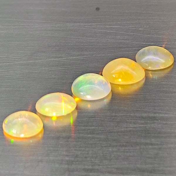 Natural Multi Color Opal Gemstones 2.04 Ct. 5 Pcs. Oval Cabochon Shape 6.1 x 5.5 Mm.: Product ID: 818728430 Product Name: Natural Opal Weight: 2.04 CT. Size: 6.1 x 5.5 x 2.8 MM. Shape: Oval Cabochon Color: Multi-Color Clarity:Semi - Transparent Luster: Strong Iridescent Gems Origin: Et