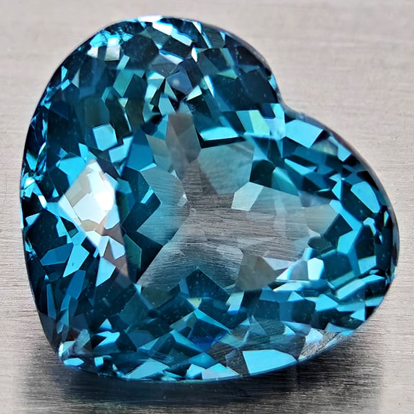 Natural London Blue Topaz Gemstones 3.61 Ct. Heart Shape 9.7 x 8.8 Mm.: Product ID: 807168361 Product Name: Natural Blue Topaz Weight: 3.61 CT. Size: 9.7 x 8.8 x 6 MM. Shape: Heart Shape Color: London Blue Clarity:VVS - VSI Luster: Good Gems Origin: Brazil Treatment: Trea