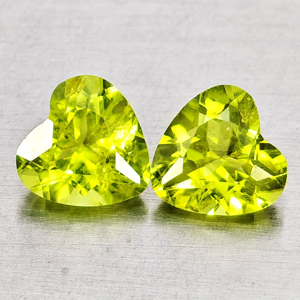 Natural Green Peridot Gemstones 1.61 Ct. 2 Pcs. Heart Shape 6 x 6 Mm.: Product ID: 805317308 Product Name: Natural Peridot Weight: 1.61 CT. Size: 6 x 6 x 3.5 MM. Shape: Heart Shape Color: Green Clarity:VSI - SI1 Luster: Good Gems Origin: Pakistan Treatment: Unheated Crys