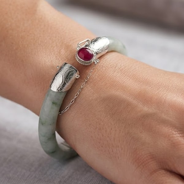Natural Green Jade Bangle 361.02 Ct. with Silver Diameter 58 Mm. And Red Ruby Gemstones: Product ID: 819814636 Product Name: Natural Jade Weight: 361.02 CT. Size: 78 x 58 x 14 MM. Shape: Round Color: Green Clarity:Opaque Luster: Good Gems Origin: Thailand Treatment: Unheated Crystal Struc