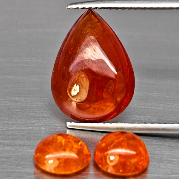 Natural Orangish Red Spessartine Garnet Gemstones 13.67 Ct. 3 Pcs. Mixed Cabochon Shape and Mixed: Product ID: 802938031 Product Name: Natural Garnet Weight: 13.67 CT. Size: 15.5 x 11.5 x 5.6 to 7.4 x 7.4 x 4.5 MM. Shape: Mixed Shape Color: Orangish Red Clarity:SI1 Luster: Good Gems Origin: Namibia