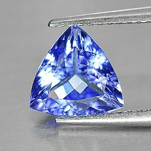 Natural Violetish Blue Tanzanite Gemstone 1.56 Ct. Clean Trilliant Shape 8.3 x 8 Mm.: Product ID: 807009304 Product Name: Natural Tanzanite Weight: 1.56 CT. Size: 8.3 x 8 x 4 MM. Shape: Trilliant Color: Violetish Blue Clarity:IF Luster: Good Gems Origin: Tanzania Treatment: Heated Crys