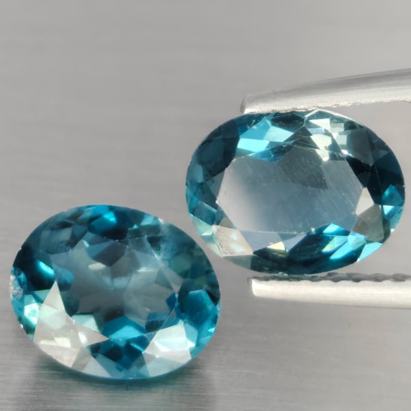 Natural London Blue Topaz Gemstones 3.97 Ct. 2 Pcs. Oval Shape 9 x 7.4 Mm.: Product ID: 807168906 Product Name: Natural Blue Topaz Weight: 3.97 CT. Size: 9 x 7.4 x 4.9 MM. Shape: Oval Color: London Blue Clarity:SI1 Luster: Good Gems Origin: Brazil Treatment: Treated Crystal S