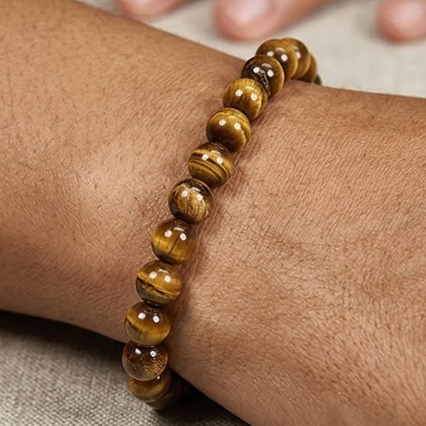 Natural Yellow Brown Color Tigers Eye Gemstones 48.15 Ct. Beads Bracelet Length 6 Inch.: Product ID: 811600316 Product Name: Natural Agate Weight: 48.15 CT. Size: 6 Inch 6.7 x 6.7 MM. Shape: Round Cabochon Color: Yellow Brown Clarity:Opaque Luster: Good Gems Origin: Thailand Treatment: Un