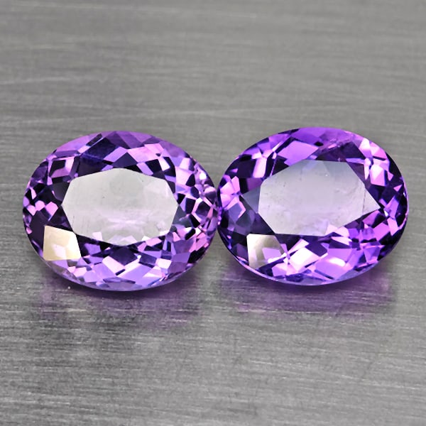Natural Purple Amethyst Gemstones 7.65 Ct. 2 Pcs. Oval Shape 11.5 x 9.6 Mm.: Product ID: 800325647 Product Name: Natural Amethyst Weight: 7.65 CT. Size: 11.5 x 9.6 x 6.1 MM. Shape: Oval Shape Color: Purple Clarity:VSI Luster: Good Gems Origin: Brazil Treatment: Unheated Crysta